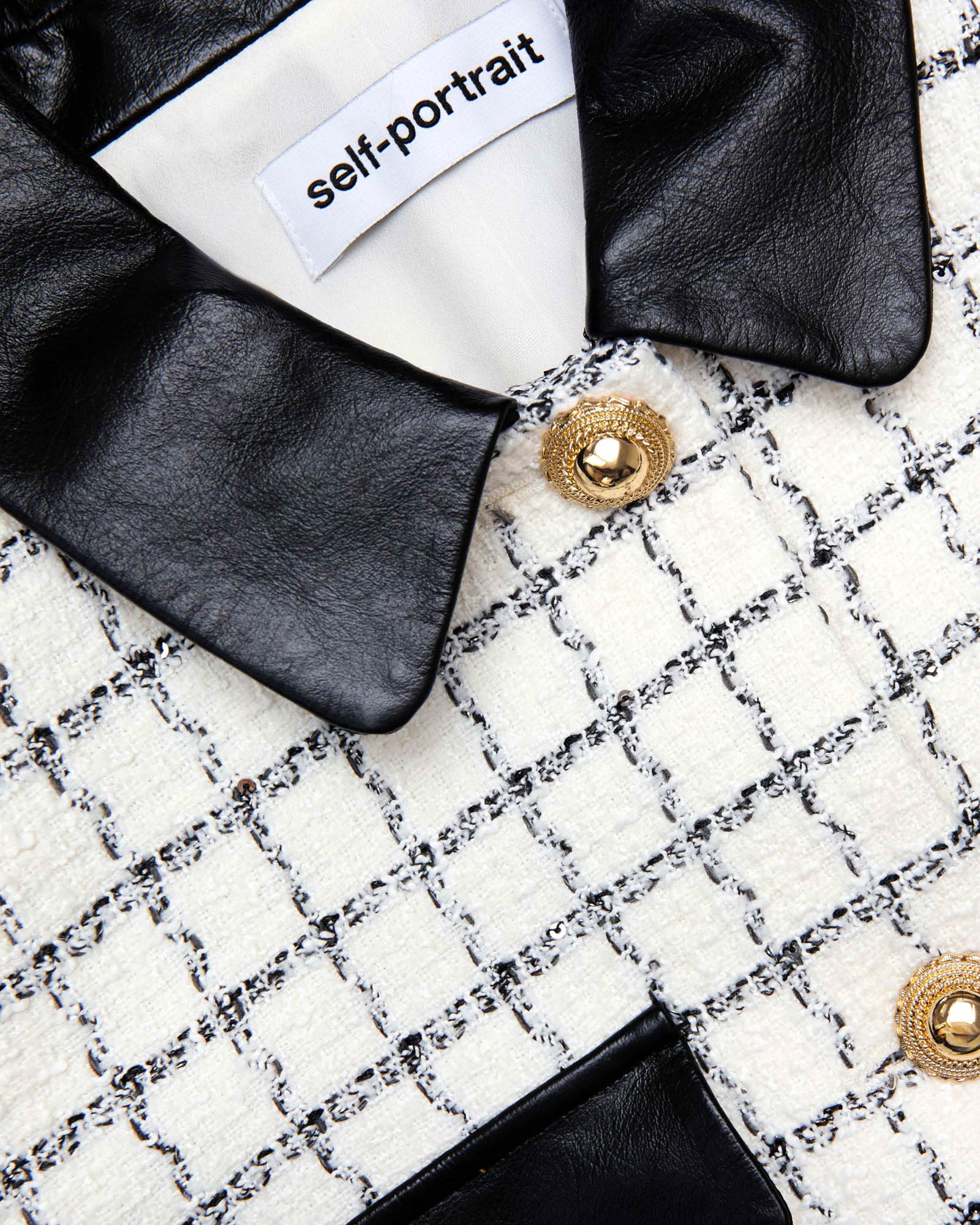 Veste à revers en fourrure bouclée à carreaux