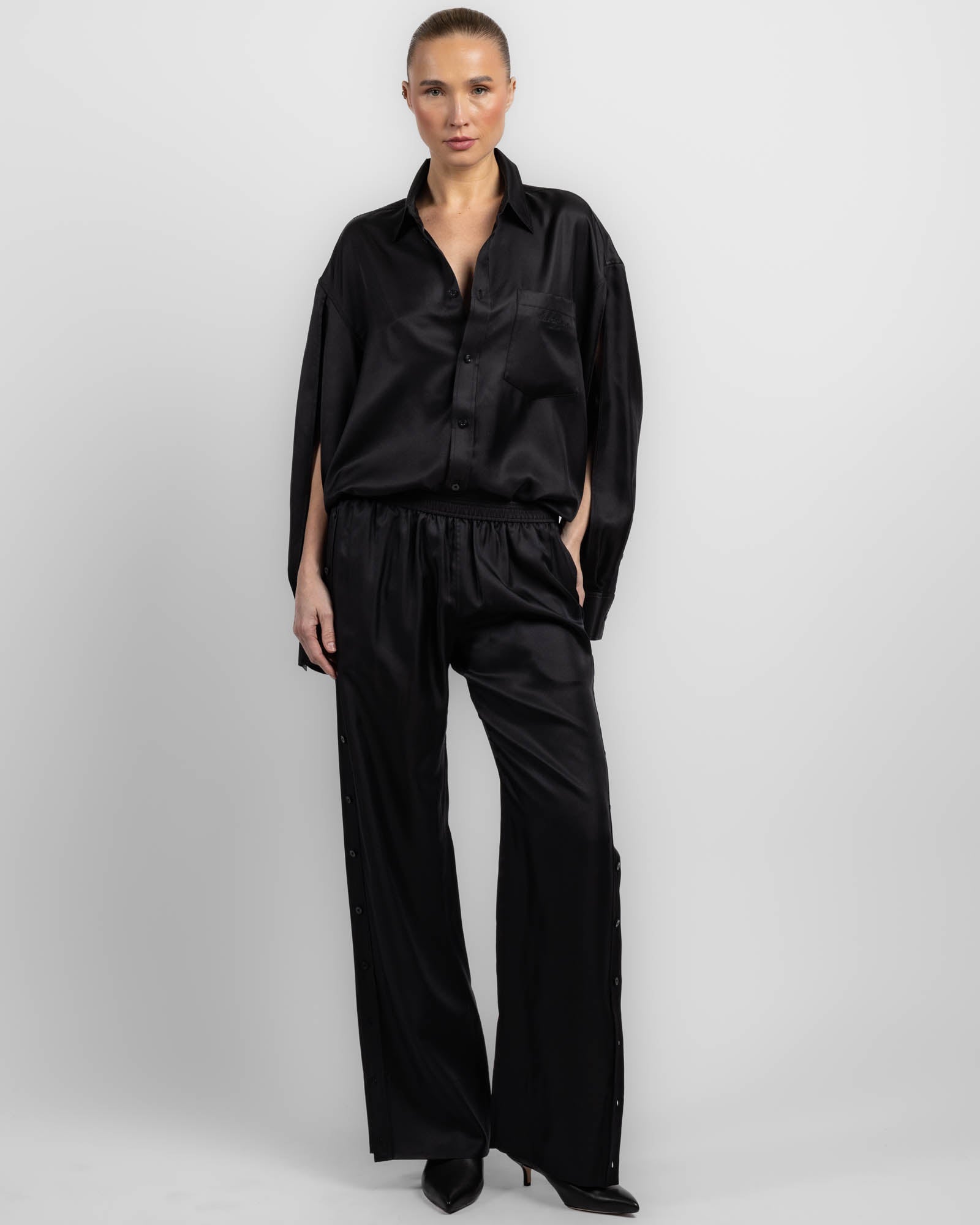 Pantalon à patte de boutonnage latérale