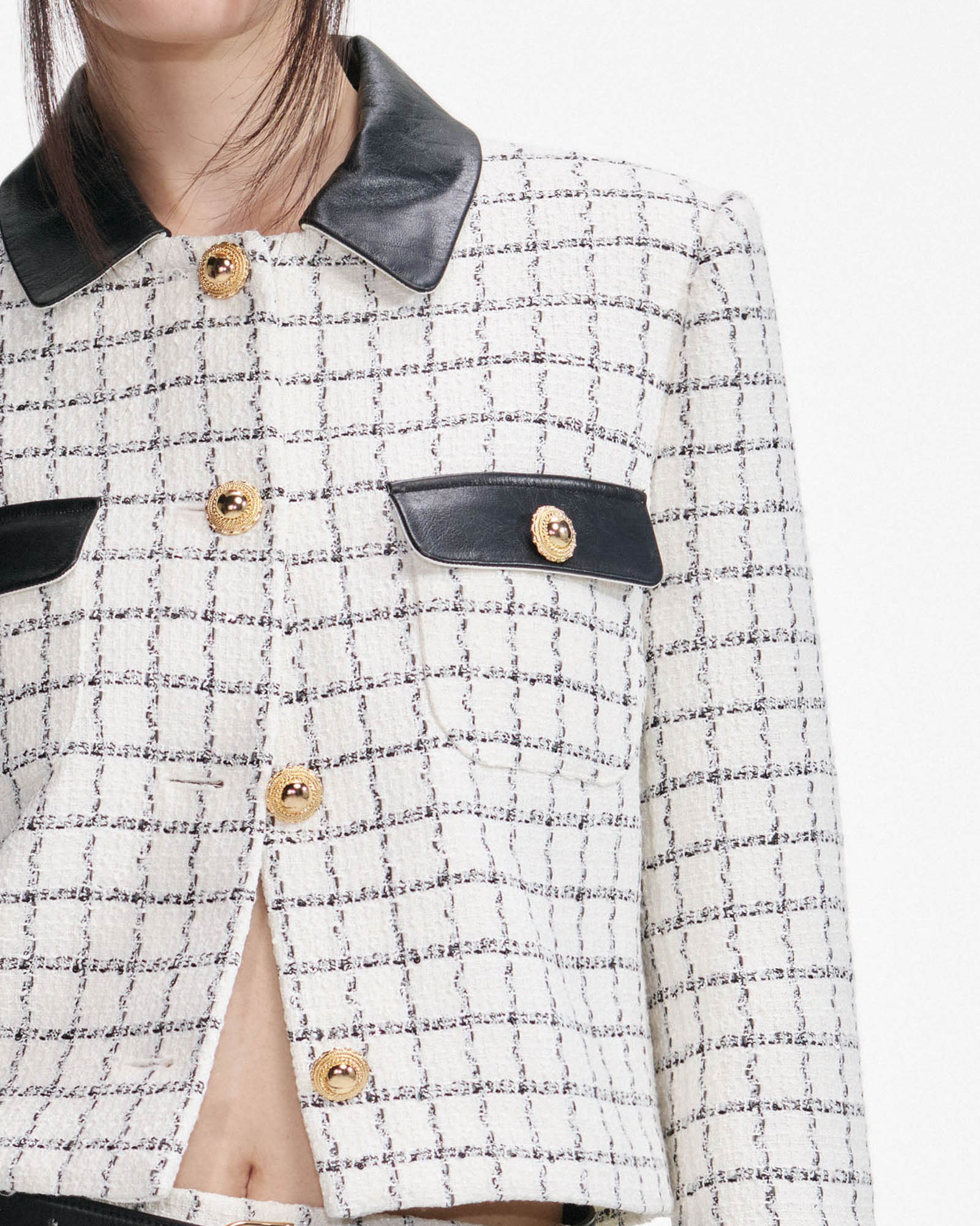 Veste à revers en fourrure bouclée à carreaux