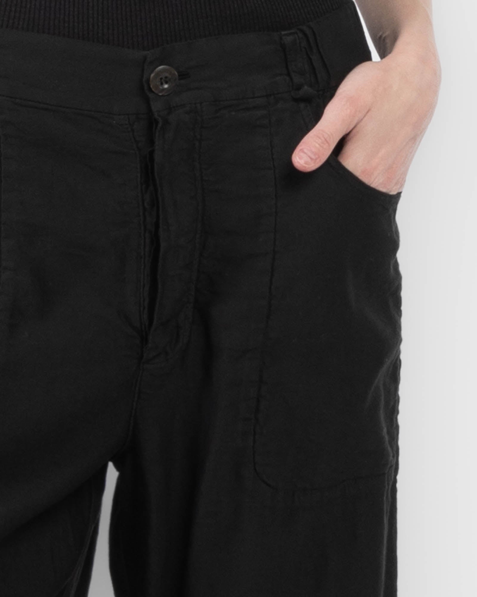 Pantalon à jambes courbées