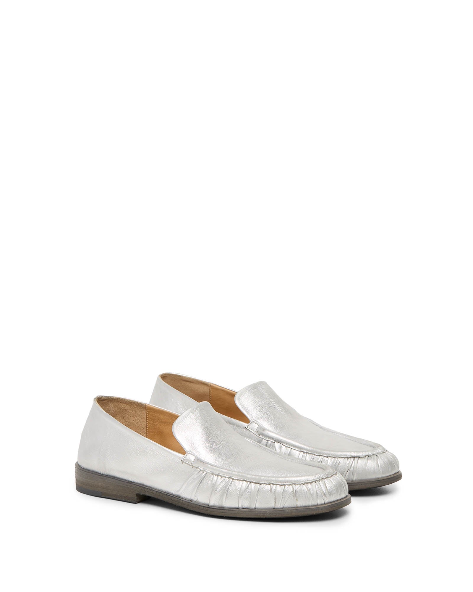 White and silver loafers top