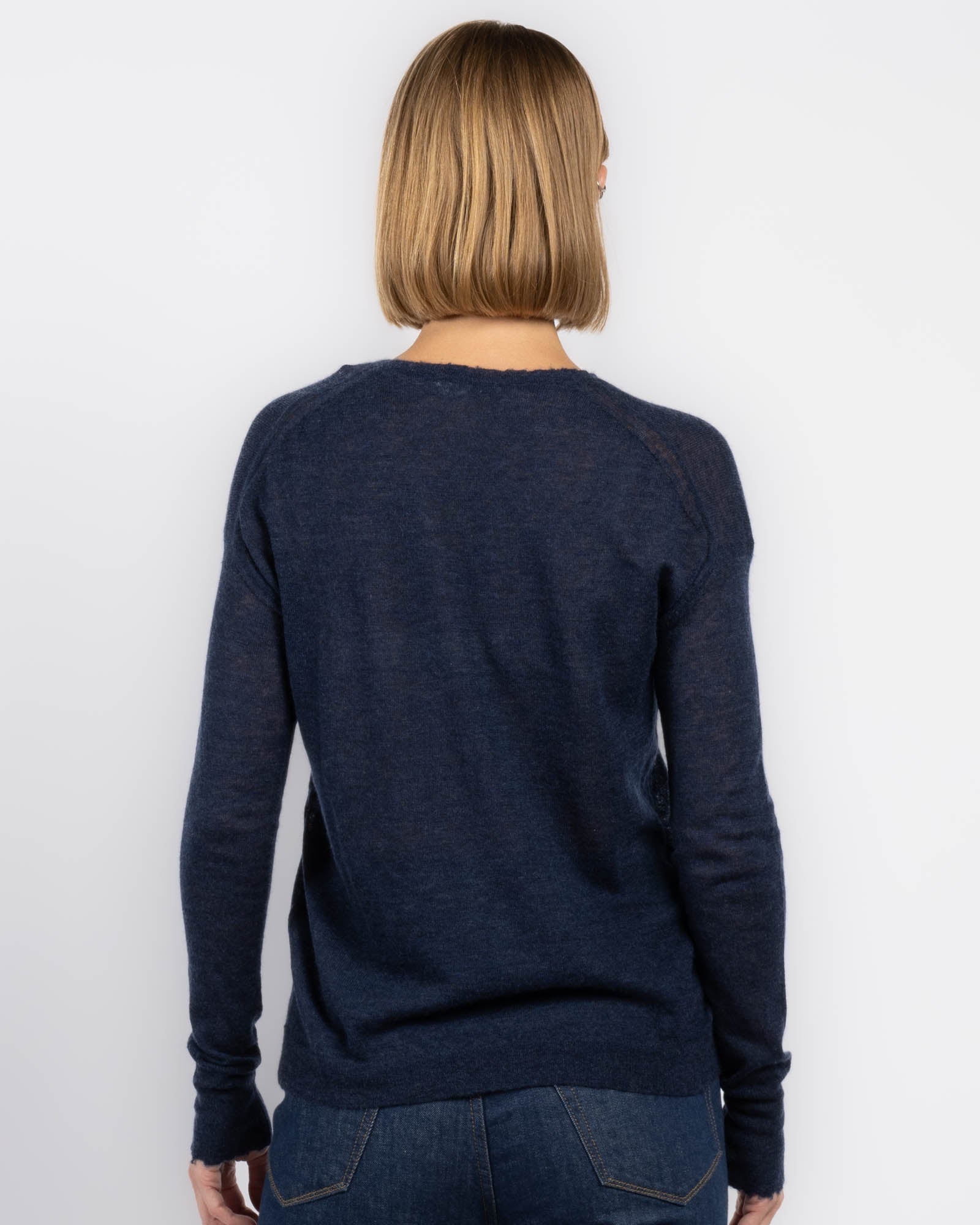 Pull ras du cou à bords bruts