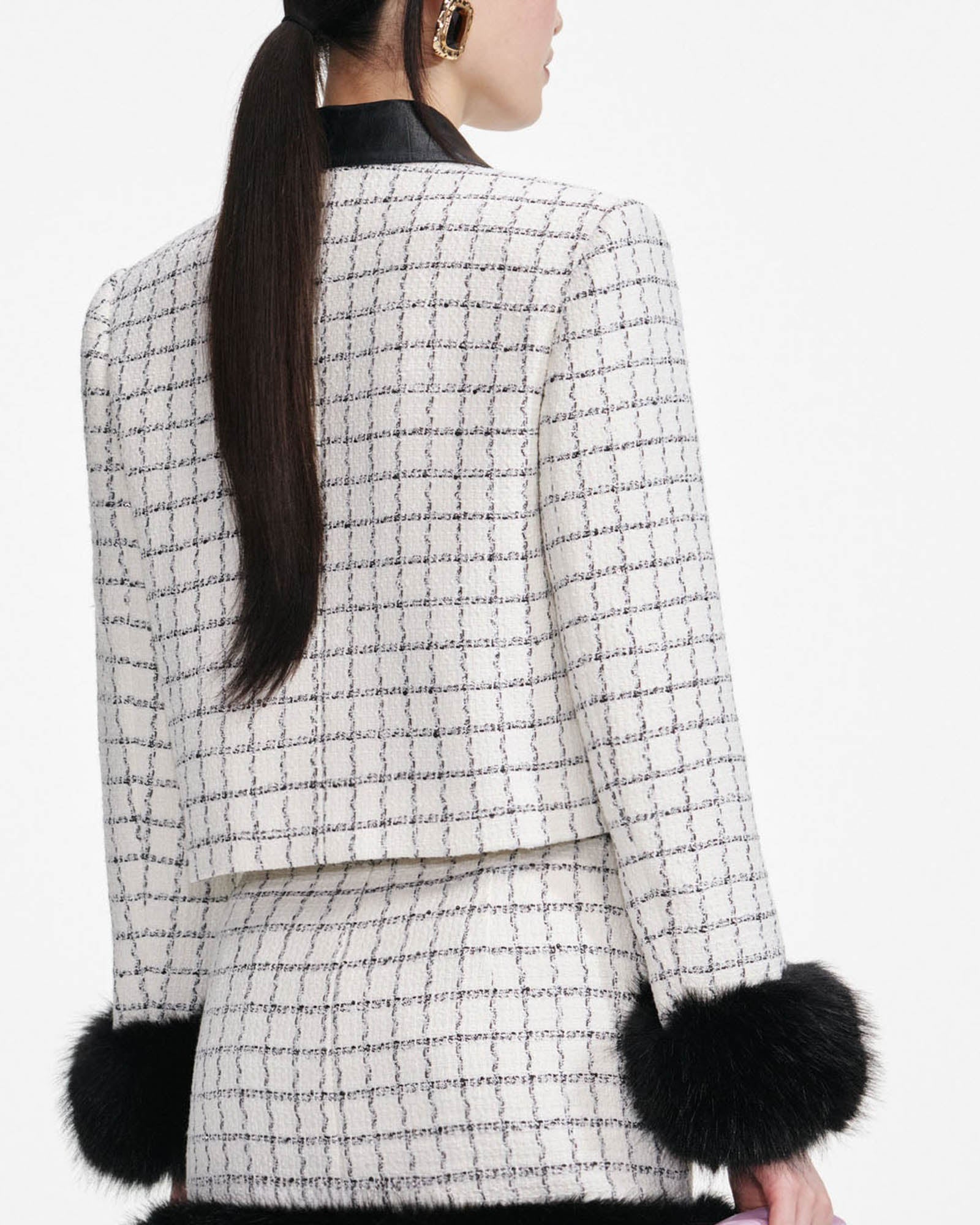 Veste à revers en fourrure bouclée à carreaux